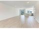 Bright and airy living room with light tile flooring, sliding glass doors, and recessed lighting at 317 Via Tuscany Ave, Sarasota, FL 34243