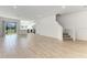 Open floor plan showcasing the living room, kitchen, and staircase with access to the patio at 317 Via Tuscany Ave, Sarasota, FL 34243