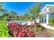 Lounge poolside in a beautifully landscaped community, perfect for relaxation and social gatherings at 317 Via Tuscany Ave, Sarasota, FL 34243