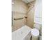 Bathroom with a walk-in shower with grab bar and seat, alongside a toilet at 3222 Sycamore Ter, Sarasota, FL 34237