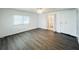 Clean bedroom with natural light, closet and wood flooring at 3222 Sycamore Ter, Sarasota, FL 34237