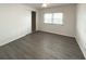 A well-lit bedroom with gray flooring and natural light from the windows at 3222 Sycamore Ter, Sarasota, FL 34237
