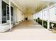 Long carport featuring a door with access and ample parking at 3222 Sycamore Ter, Sarasota, FL 34237