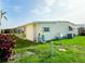 Inviting home showcasing a lush yard, covered parking, and serene outdoor space at 3222 Sycamore Ter, Sarasota, FL 34237