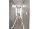 Hallway with gray walls and contrasting light-colored trim leading to interior rooms at 3222 Sycamore Ter, Sarasota, FL 34237