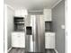 Spacious kitchen with stainless steel refrigerator and modern appliances at 3222 Sycamore Ter, Sarasota, FL 34237