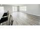 Bright, open living room featuring hardwood floors, high top seating, and natural light at 3222 Sycamore Ter, Sarasota, FL 34237