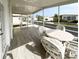 Covered patio with a dining set, offering a comfortable outdoor seating area at 3222 Sycamore Ter, Sarasota, FL 34237