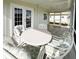 Covered patio with a dining set, perfect for enjoying outdoor meals and gatherings at 3222 Sycamore Ter, Sarasota, FL 34237