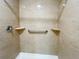 The walk-in shower includes grab bars and built-in shelving for convenience at 3222 Sycamore Ter, Sarasota, FL 34237