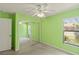 Bright bedroom with carpet, ceiling fan, and mirrored sliding closet at 3311 39Th W Pl, Bradenton, FL 34205