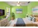 Cozy bedroom featuring a beach theme, a ceiling fan and bright natural light at 3311 39Th W Pl, Bradenton, FL 34205