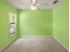 Bright bedroom featuring a ceiling fan and a large window with greenery views at 3311 39Th W Pl, Bradenton, FL 34205