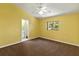 Bedroom with large window, ceiling fan, neutral carpet, and en-suite bathroom at 3311 39Th W Pl, Bradenton, FL 34205