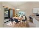 Bright dining area boasts modern decor and sliding door access to the patio at 3311 39Th W Pl, Bradenton, FL 34205