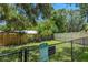 Community dog park features grassy area, fence enclosure, and clearly posted rules at 3311 39Th W Pl, Bradenton, FL 34205