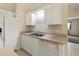 Functional kitchen featuring white appliances, cabinets, and ample counter space at 3311 39Th W Pl, Bradenton, FL 34205