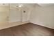 Living room with carpet, neutral walls, and tile flooring in adjacent room at 3311 39Th W Pl, Bradenton, FL 34205