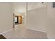 Living room with tile flooring, neutral walls, and view into adjacent room at 3311 39Th W Pl, Bradenton, FL 34205