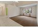 Living room with carpet, neutral walls, and a window with sheer curtains at 3311 39Th W Pl, Bradenton, FL 34205