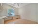 Office featuring built-in desk and cabinets, tile floors, and natural light at 3317 Highlands Bridge Rd # 61, Sarasota, FL 34235