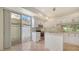 Bright kitchen featuring white cabinetry, stainless steel appliances, island, and sliding door to patio at 3317 Highlands Bridge Rd # 61, Sarasota, FL 34235