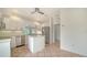 Modern kitchen with white cabinets, stainless steel appliances, and a center island at 3317 Highlands Bridge Rd # 61, Sarasota, FL 34235