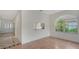 Open-concept dining room featuring a view to the kitchen, large window and decorative tile flooring at 3317 Highlands Bridge Rd # 61, Sarasota, FL 34235