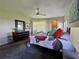 Cozy bedroom features a colorful bedspread, carpeted floors, and neutral walls at 3500 El Conquistador Pkwy # 347, Bradenton, FL 34210