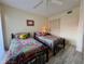 Bedroom featuring two twin beds, ceiling fan, and closet at 3500 El Conquistador Pkwy # 347, Bradenton, FL 34210