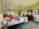 Comfortable bedroom with colorful quilt, carpeted floors, and a dresser with mirror at 3500 El Conquistador Pkwy # 347, Bradenton, FL 34210