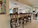 Bright open kitchen with bar seating, stainless appliances, and modern finishes provides a great flow at 3500 El Conquistador Pkwy # 347, Bradenton, FL 34210