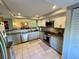 Bright kitchen features stainless appliances, updated countertops, open to the dining area, and lots of natural light at 3500 El Conquistador Pkwy # 347, Bradenton, FL 34210