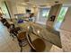 Modern kitchen with granite countertops, stainless steel appliances, and bar seating for seamless entertaining at 3500 El Conquistador Pkwy # 347, Bradenton, FL 34210