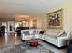 Spacious living room featuring a comfortable sectional sofa, decorative artwork, and seamless flow at 3500 El Conquistador Pkwy # 347, Bradenton, FL 34210