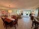 Open living and dining area with tile flooring, natural light, and comfortable seating at 3500 El Conquistador Pkwy # 347, Bradenton, FL 34210