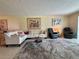 Inviting living room featuring a sectional sofa, recliners, and stylish decor for comfortable living at 3500 El Conquistador Pkwy # 347, Bradenton, FL 34210
