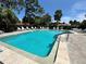 Enjoy this large in-ground pool with beautiful landscaping and lounge chairs, perfect for relaxation and entertaining at 3500 El Conquistador Pkwy # 347, Bradenton, FL 34210