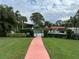 Community pool with green fence at 3500 El Conquistador Pkwy # 347, Bradenton, FL 34210