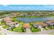 Beautiful aerial view of a home in a lakeside community, featuring a large backyard and a tile roof at 3504 Big Sky Way, Bradenton, FL 34211