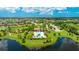 Beautiful aerial shot showcases the community pool and surrounding green spaces by a lake, close to residential areas at 3504 Big Sky Way, Bradenton, FL 34211