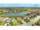 Beautiful aerial view of a home in a lakeside community, featuring a large backyard and a tile roof at 3504 Big Sky Way, Bradenton, FL 34211