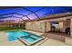Inviting backyard with a screened-in pool and spa, plus an outdoor seating and dining area at 3504 Big Sky Way, Bradenton, FL 34211