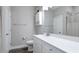 Well-lit bathroom featuring a modern vanity, sink, and a shower with tiled walls at 3504 Big Sky Way, Bradenton, FL 34211