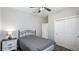 Bright bedroom featuring wood-look floors, closet space, and a ceiling fan at 3504 Big Sky Way, Bradenton, FL 34211