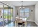 Cozy dining area with sliding glass doors offering outdoor views at 3504 Big Sky Way, Bradenton, FL 34211