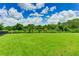 Expansive dog park with lush green grass and secure fencing, an ideal space for pets to exercise and socialize at 3504 Big Sky Way, Bradenton, FL 34211