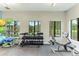 Fitness center featuring free weights, weight machines, and scenic outdoor views at 3504 Big Sky Way, Bradenton, FL 34211