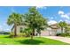 Beautiful single-story home featuring lush landscaping, and a brick paved driveway at 3504 Big Sky Way, Bradenton, FL 34211