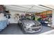 Well-organized garage featuring a sleek Shelby Mustang and ample storage solutions at 3504 Big Sky Way, Bradenton, FL 34211